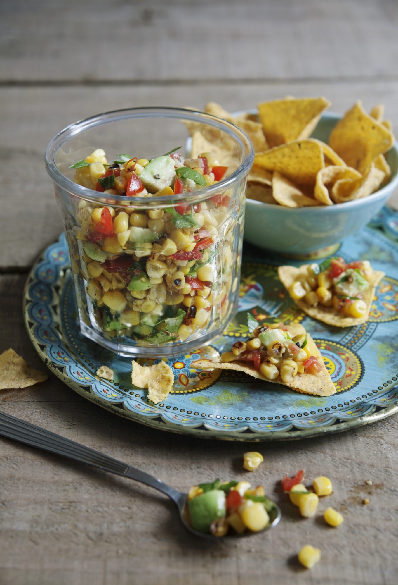 Sweetcorn and avocado salsa with limes and tomatoes.jpg