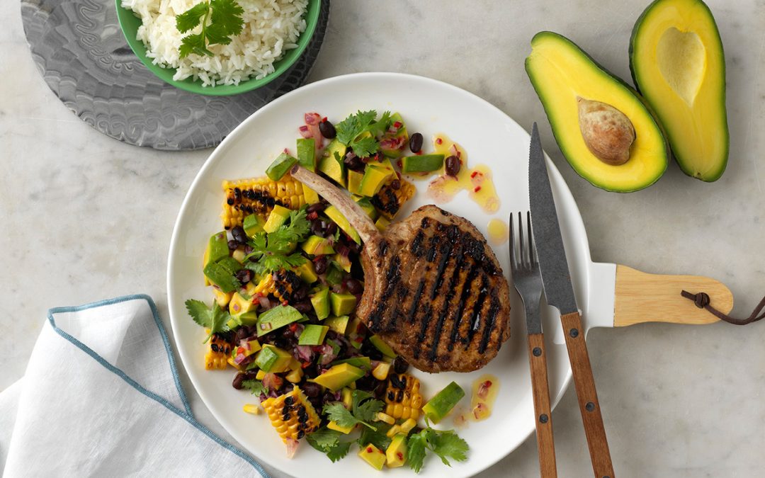 Grilled Jerk Pork Cutlets with Charred Corn and Avocado Salsa.