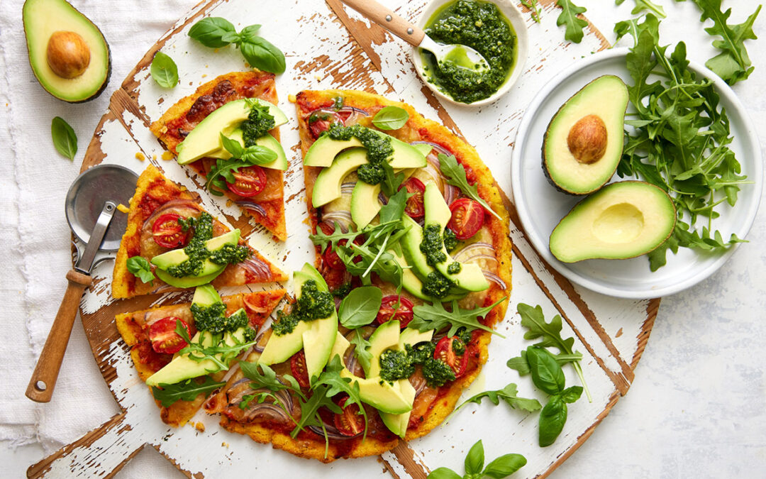 Herb crusted Polenta Pizza base topped with Avocado and pesto
