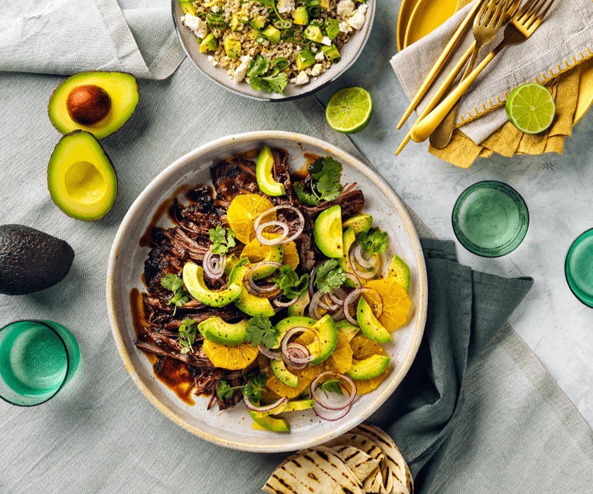 Smoky brisket with avocado-orange salad, avocado rice and tortilla chips 