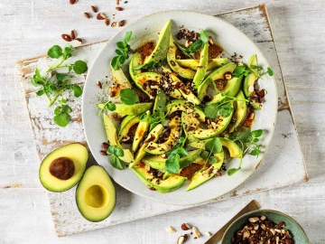 Avocado salad with miso-ginger dressing and savoury granola